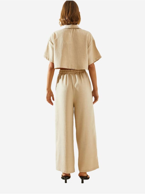 Completo due pezzi con colletto della giacca e pantaloni con bottoni e tasche lucci - Kiabi