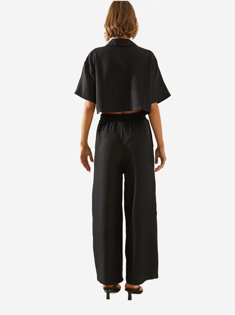 Completo due pezzi con colletto della giacca e pantaloni con bottoni e tasche lucci Nero - Kiabi