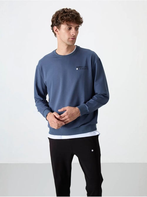 Completo felpa e pantaloni oversize girocollo tommy - Kiabi Completo felpa e pantaloni oversize girocollo tommy - Kiabi