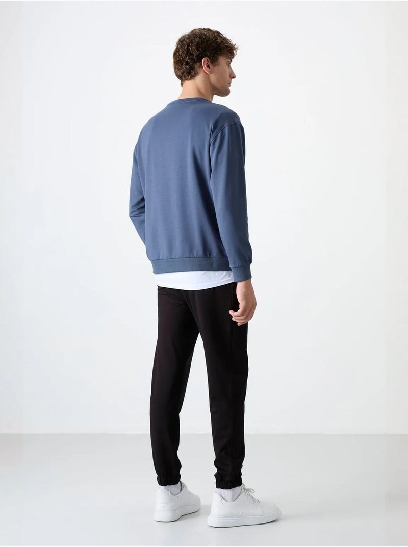 Completo felpa e pantaloni oversize girocollo tommy Blu - Kiabi
