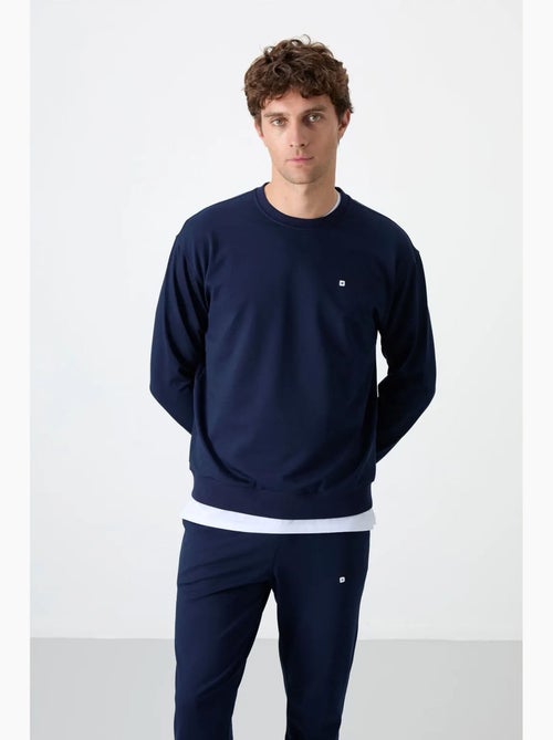 Completo felpa e pantaloni oversize girocollo tommy - Kiabi Completo felpa e pantaloni oversize girocollo tommy - Kiabi