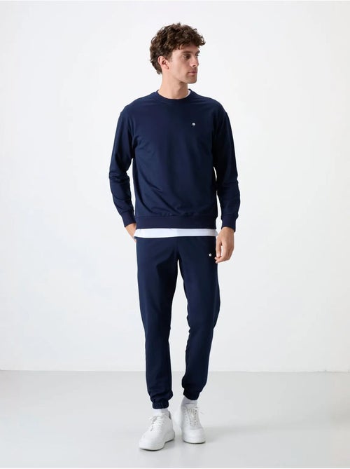 Completo felpa e pantaloni oversize girocollo tommy - Kiabi Completo felpa e pantaloni oversize girocollo tommy - Kiabi