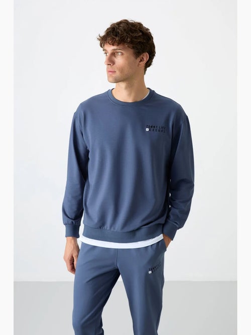 Completo felpa e pantaloni oversize girocollo tommy - Kiabi Completo felpa e pantaloni oversize girocollo tommy - Kiabi
