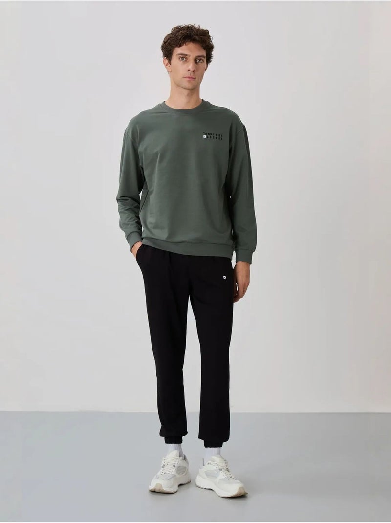 Completo felpa e pantaloni oversize girocollo tommy Verde scuro - Kiabi