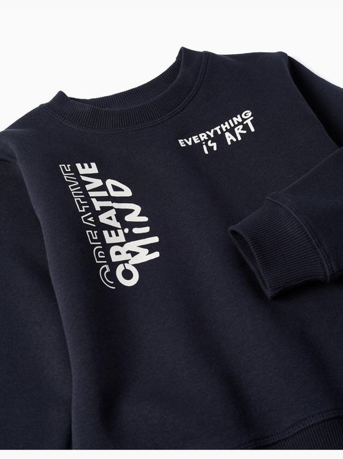 Completo jogging spazzolato con stampa creativa - Kiabi Completo jogging spazzolato con stampa creativa - Kiabi