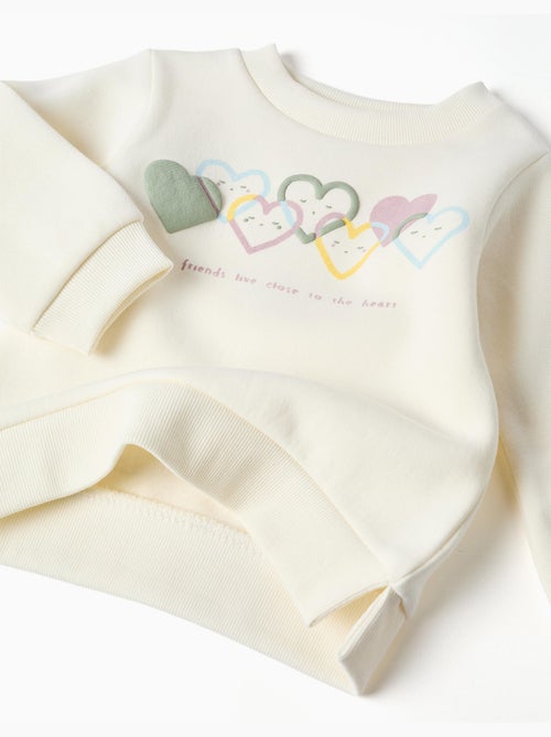 Completo jogging spazzolato con stampa cuore - Kiabi Completo jogging spazzolato con stampa cuore - Kiabi