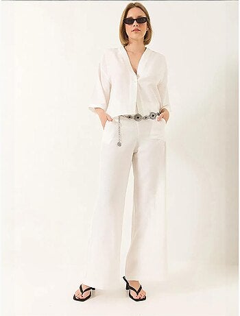 Completo pantaloni palazzo kimono in lino con maniche a pipistrello e scollo a v lucci