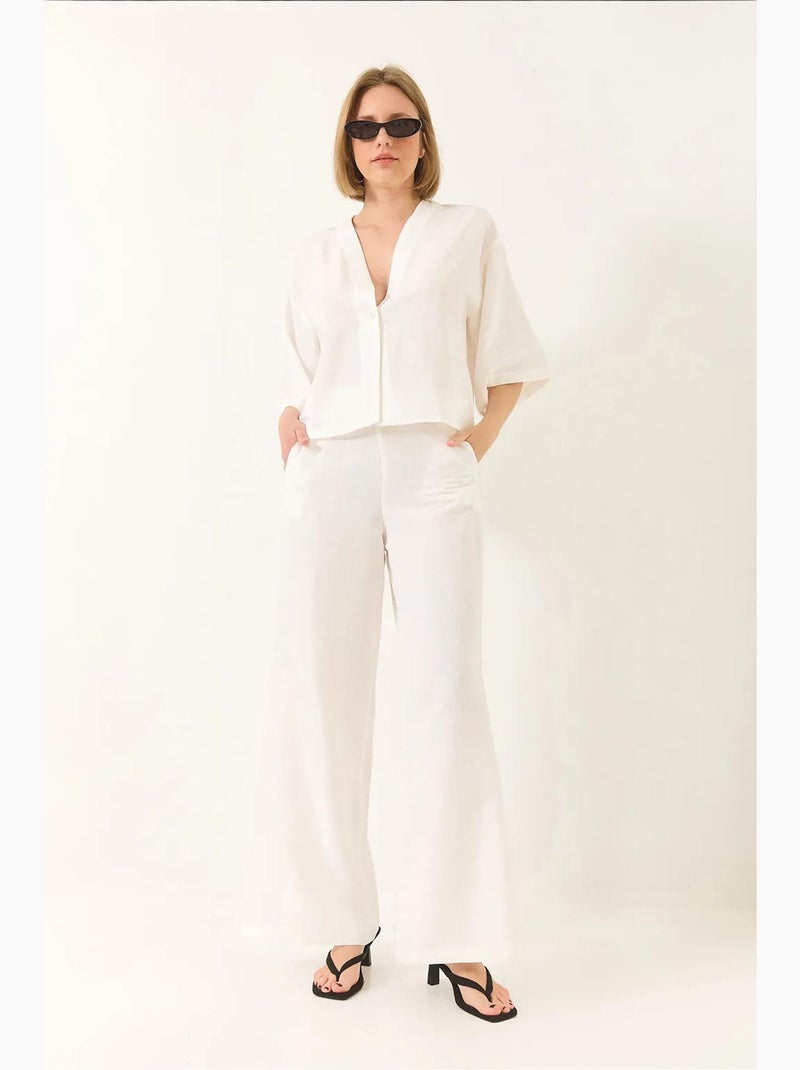 Completo pantaloni palazzo kimono in lino con maniche a pipistrello e scollo a v lucci Bianco - Kiabi