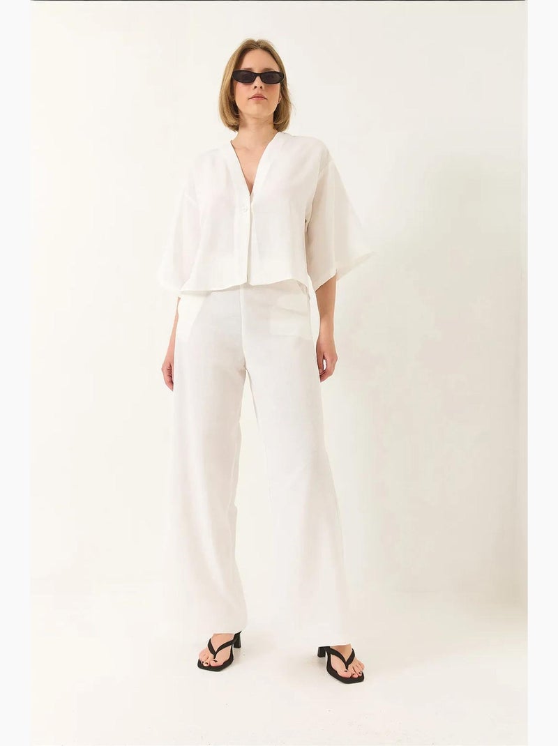 Completo pantaloni palazzo kimono in lino con maniche a pipistrello e scollo a v lucci Bianco - Kiabi