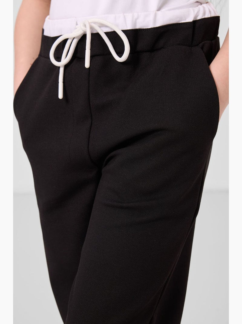 Completo sportivo in cotone e poliestere tommy Nero - Kiabi