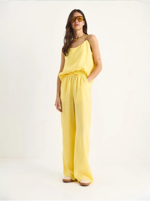 Coordinato con canotta senza maniche e pantaloni a gamba ampia lucci - Kiabi Coordinato con canotta senza maniche e pantaloni a gamba ampia lucci - Kiabi