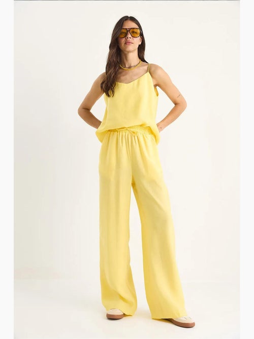 Coordinato con canotta senza maniche e pantaloni a gamba ampia lucci - Kiabi Coordinato con canotta senza maniche e pantaloni a gamba ampia lucci - Kiabi