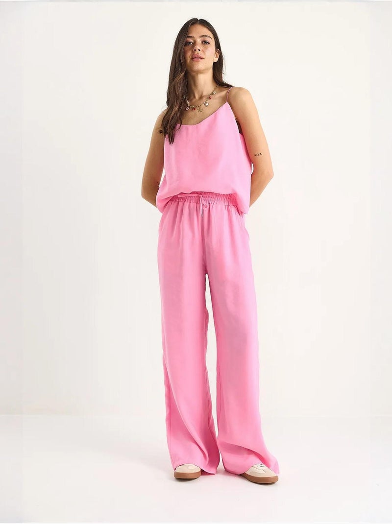 Coordinato con canotta senza maniche e pantaloni a gamba ampia lucci Rosa fluo/Solinotes - Kiabi