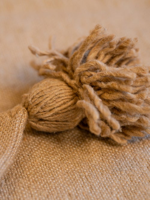 Copricuscino in lana con nappe - Kiabi