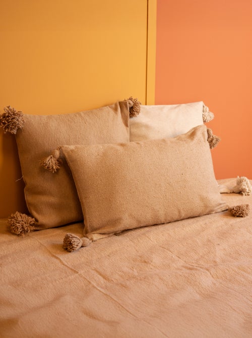 Copricuscino in lana con nappe - Kiabi