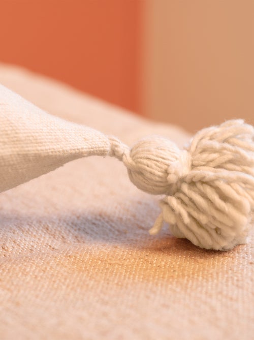 Copricuscino in lana con nappe - Kiabi