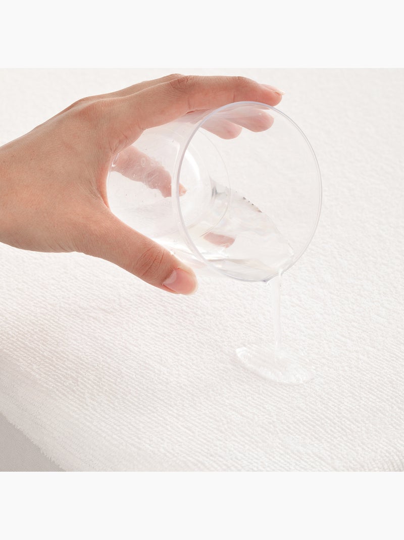 Coprimaterasso impermeabile in spugna per culla, 100% cotone, elasticizzato - Gamusi. Bianco - Kiabi