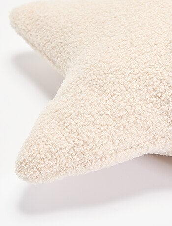 Cuscino a forma di stella in maglia bouclé