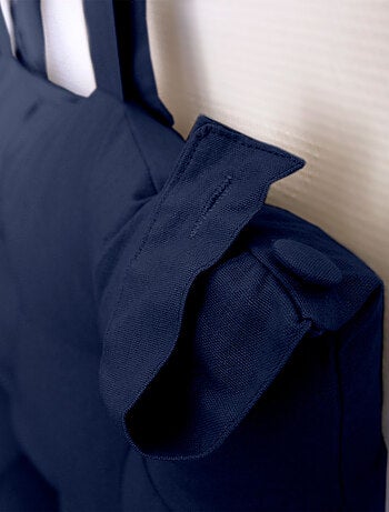 Cuscino per testiera in cotone con linguette a bottone