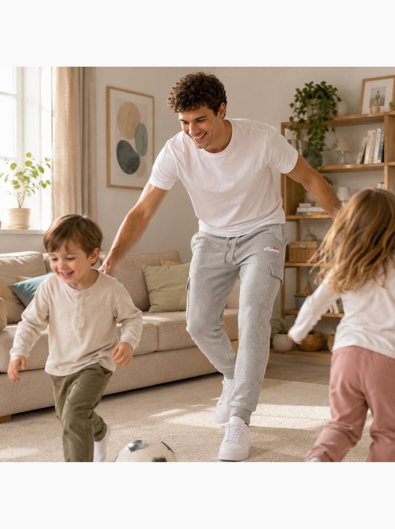 Ellesse - pantaloni da jogging dal taglio ampio, con tasche cargo e fondo stretto Grigio - Kiabi