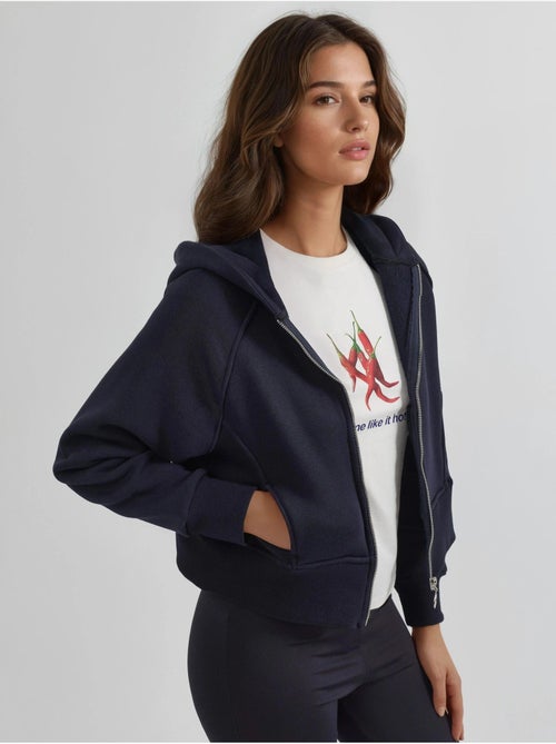 Felpa con cappuccio con zip dal taglio relaxed hiccup - Kiabi Felpa con cappuccio con zip dal taglio relaxed hiccup - Kiabi