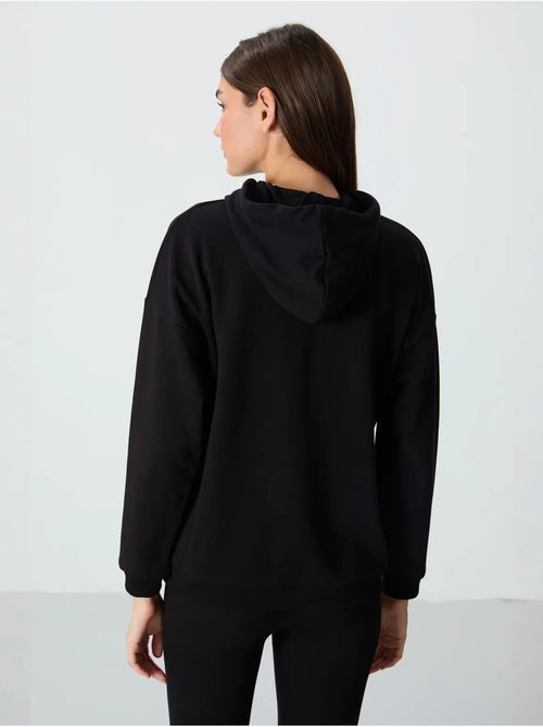 Felpa con cappuccio oversize e tasca tommy - Kiabi Felpa con cappuccio oversize e tasca tommy - Kiabi