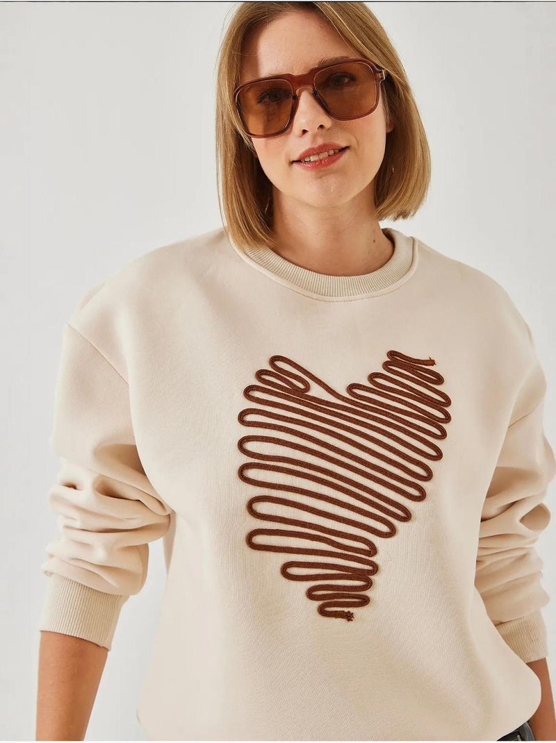 Felpa con ricamo a cuore lucci Crema - Kiabi
