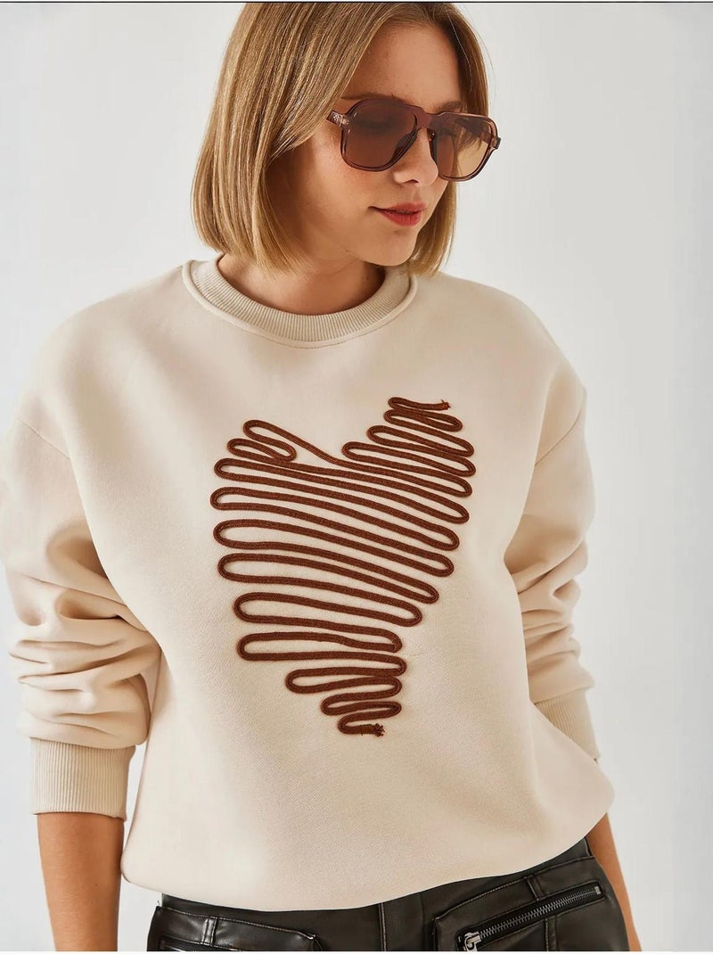 Felpa con ricamo a cuore lucci Crema - Kiabi