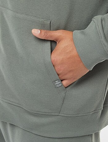 Felpa in maglia piqué con apertura con zip e cappuccio
