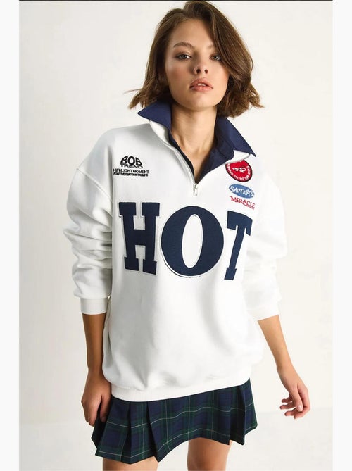 Felpa oversize con mezza zip e stampa testuale lucci - Kiabi Felpa oversize con mezza zip e stampa testuale lucci - Kiabi