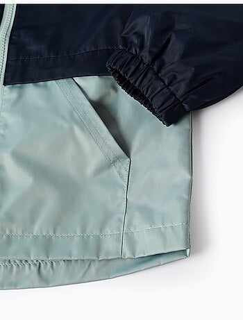 Giacca a vento con cappuccio e tasche