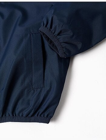 Giacca a vento con cappuccio e tasche