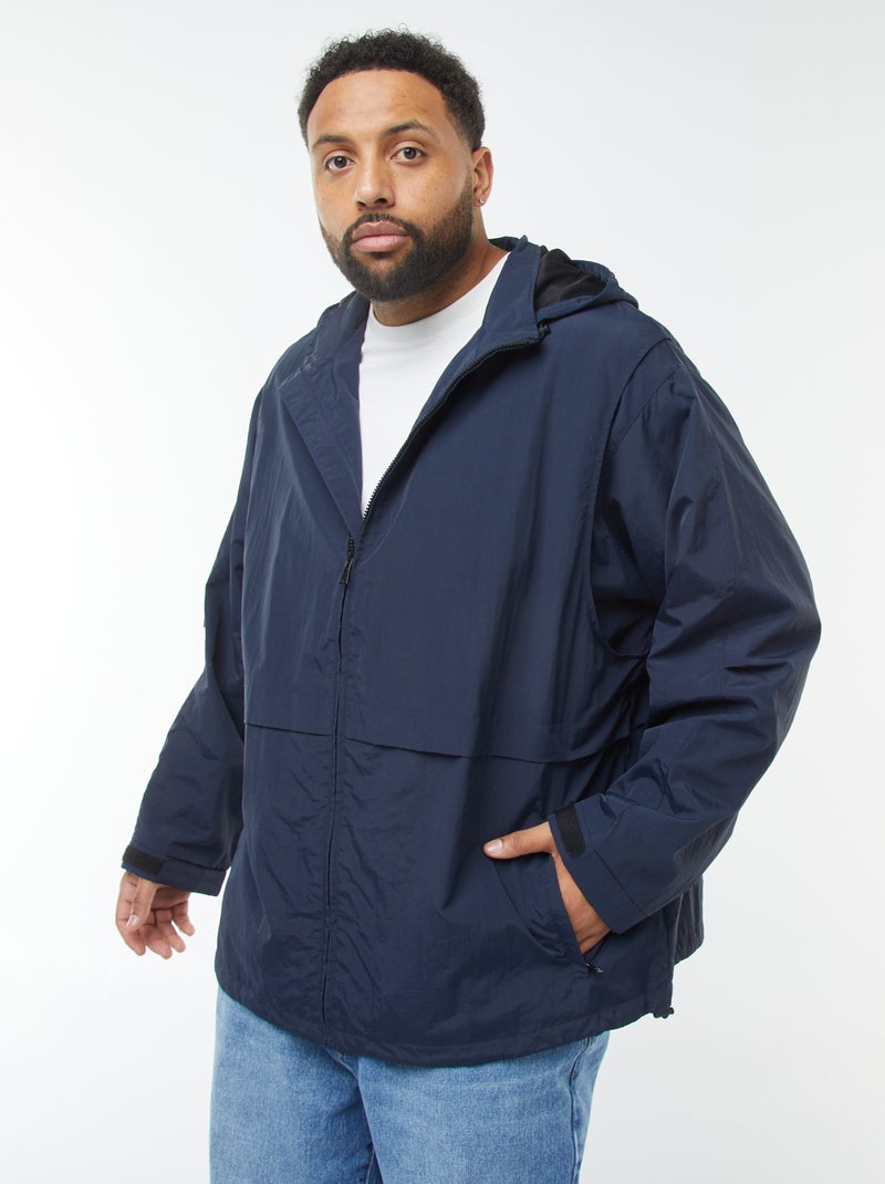 Giacca a vento impermeabile con cappuccio e maniche staccabili