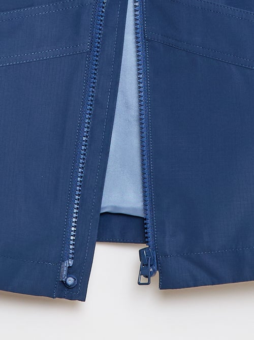 Giacca a vento tinta unita con cappuccio - Collezione facile da indossare - Kiabi