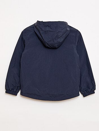 Giacca a vento tinta unita ripiegabile nel cappuccio