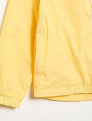 Giacca a vento tinta unita ripiegabile nel cappuccio