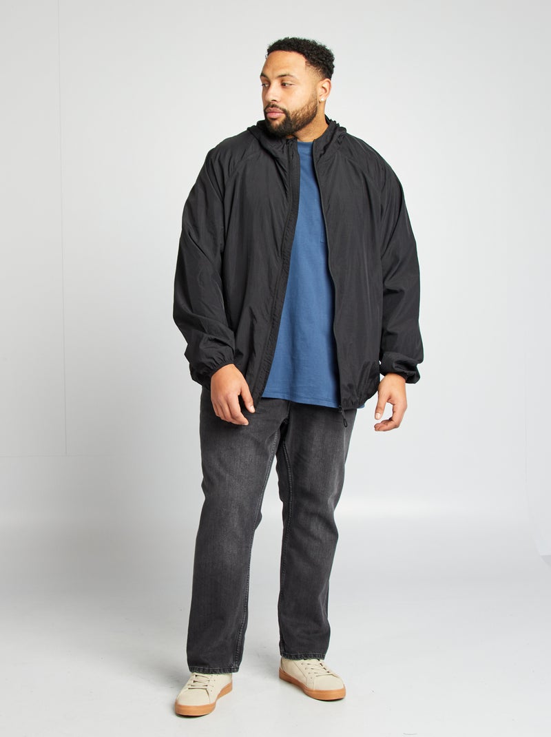 Giacca a vento tinta unita ripiegabile nel cappuccio nero - Kiabi