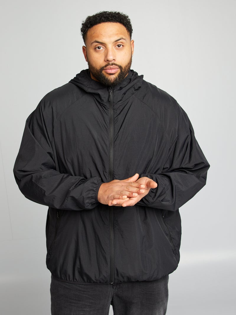 Giacca a vento tinta unita ripiegabile nel cappuccio nero - Kiabi