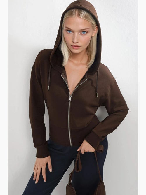 Giacca con cappuccio a maniche lunghe con zip busem - Kiabi Giacca con cappuccio a maniche lunghe con zip busem - Kiabi