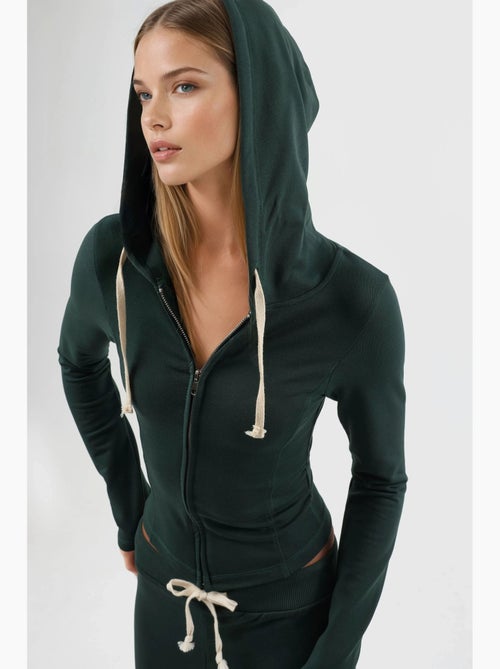 Giacca in cotone aderente con cappuccio e chiusura con zip busem - Kiabi Giacca in cotone aderente con cappuccio e chiusura con zip busem - Kiabi