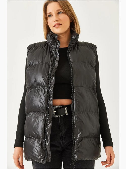Gilet con doppia tasca con cerniera lucci - Kiabi Gilet con doppia tasca con cerniera lucci - Kiabi