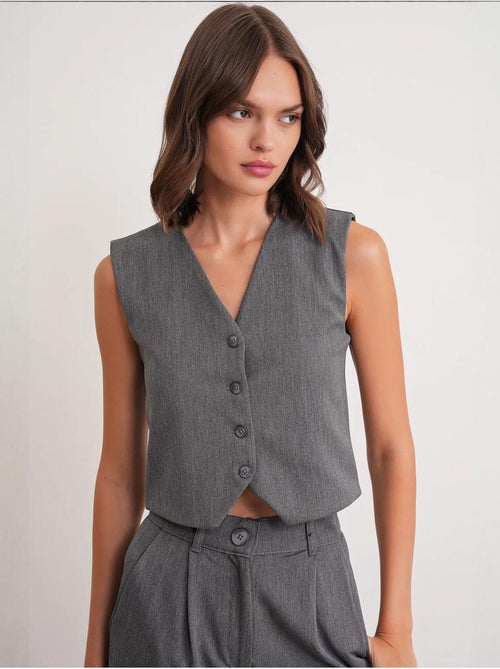 Gilet con scollo a v e bottoni mixray - Kiabi Gilet con scollo a v e bottoni mixray - Kiabi