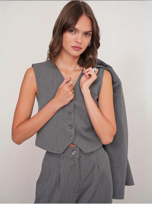 Gilet con scollo a v e bottoni mixray - Kiabi Gilet con scollo a v e bottoni mixray - Kiabi