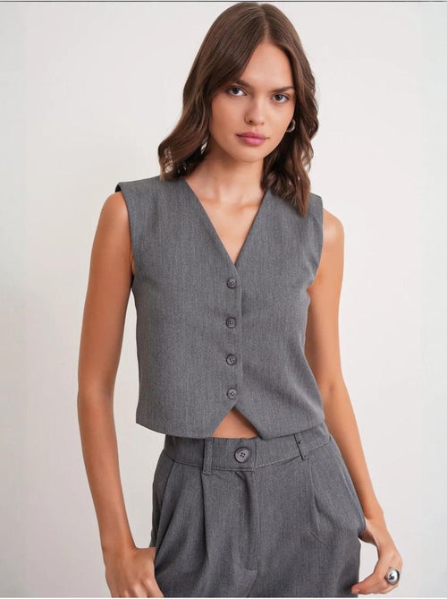 Gilet con scollo a v e bottoni mixray - Kiabi Gilet con scollo a v e bottoni mixray - Kiabi