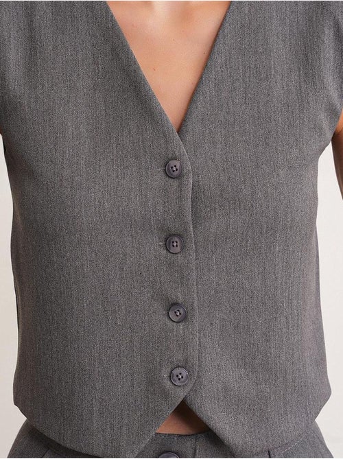 Gilet con scollo a v e bottoni mixray - Kiabi Gilet con scollo a v e bottoni mixray - Kiabi