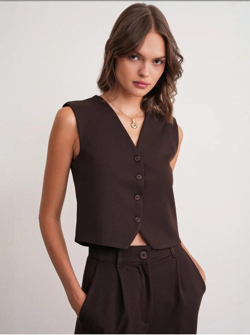 Gilet con scollo a v e bottoni mixray - Kiabi Gilet con scollo a v e bottoni mixray - Kiabi