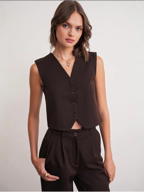 Gilet con scollo a v e bottoni mixray - Kiabi Gilet con scollo a v e bottoni mixray - Kiabi
