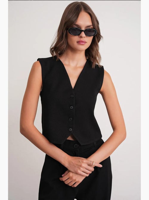 Gilet con scollo a v e bottoni mixray - Kiabi Gilet con scollo a v e bottoni mixray - Kiabi