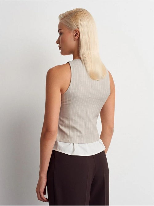 Gilet corto a righe dilvin - Kiabi Gilet corto a righe dilvin - Kiabi
