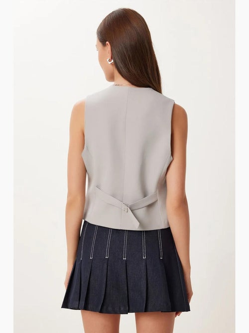Gilet corto con bottoni istanbul - Kiabi Gilet corto con bottoni istanbul - Kiabi